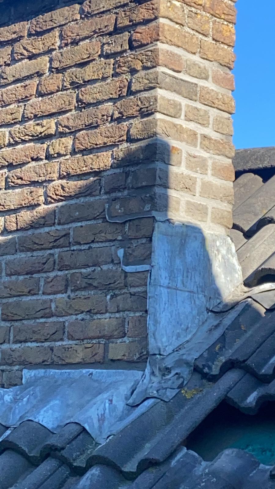 beschadigde loodslab Houten